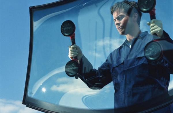 Technician holding windscreen